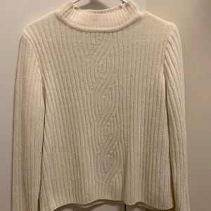 White sweater.